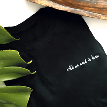 All we need is less Embroidered Unisex T-Shirt